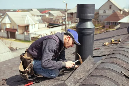 a-professional-master-roofer-with-hammer-repairs-.webp